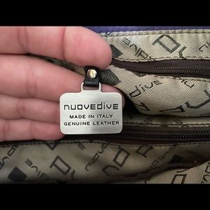 Nuovedive, like new, purple satchel.